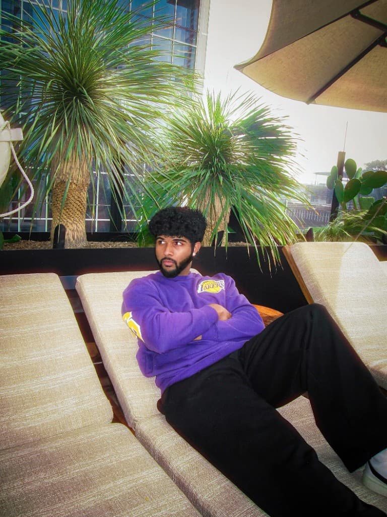 Dhruv Hegde, University of Michigan CS student, rooftop lounge portrait in Ann Arbor